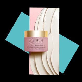 Jar of luxury skincare cream displayed against textured cosmetic swatches, highlighting premium beauty products.